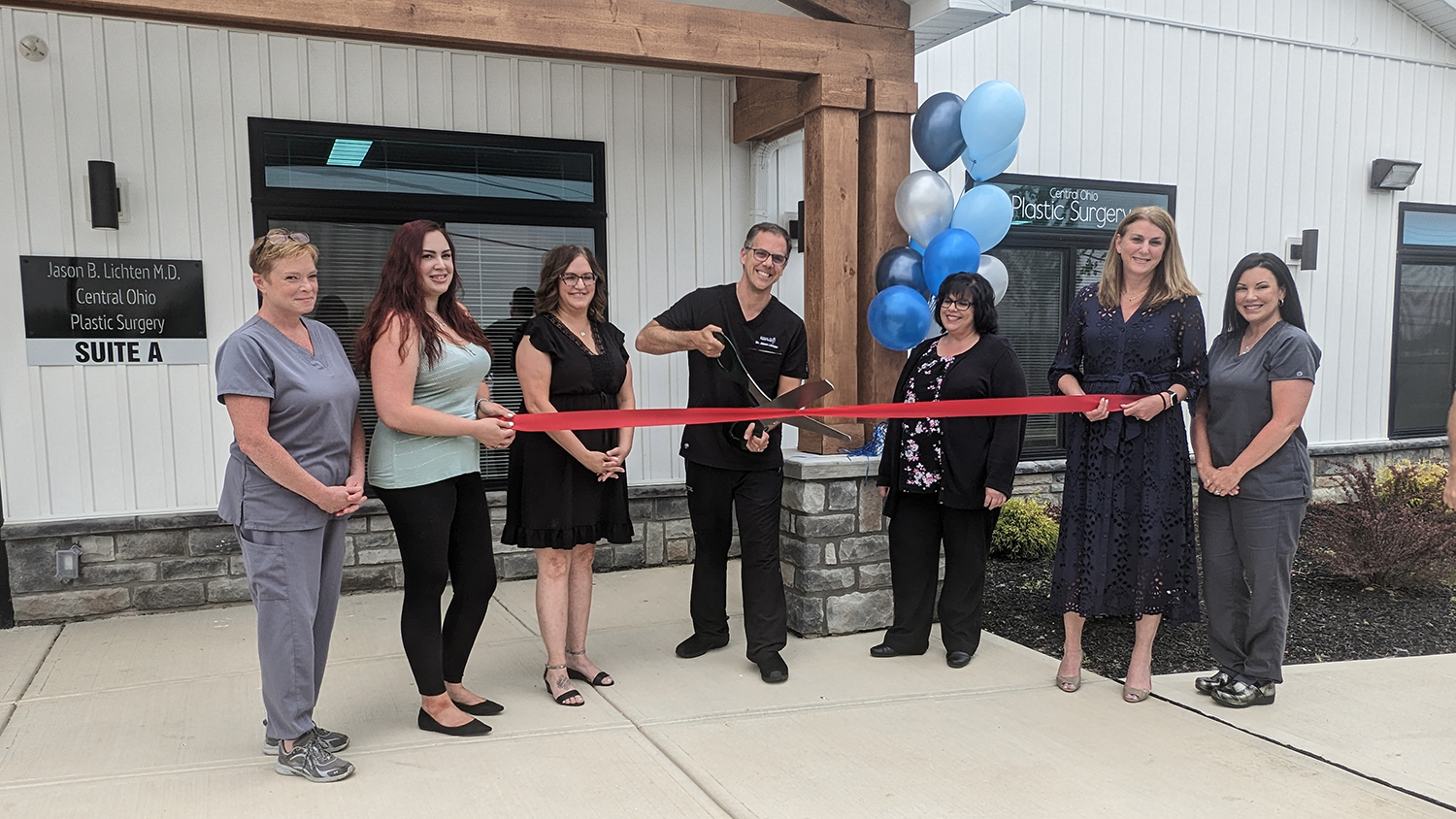 Dr. Jason Lichten cuts the ribbon at Central Ohio Plastic Surgery